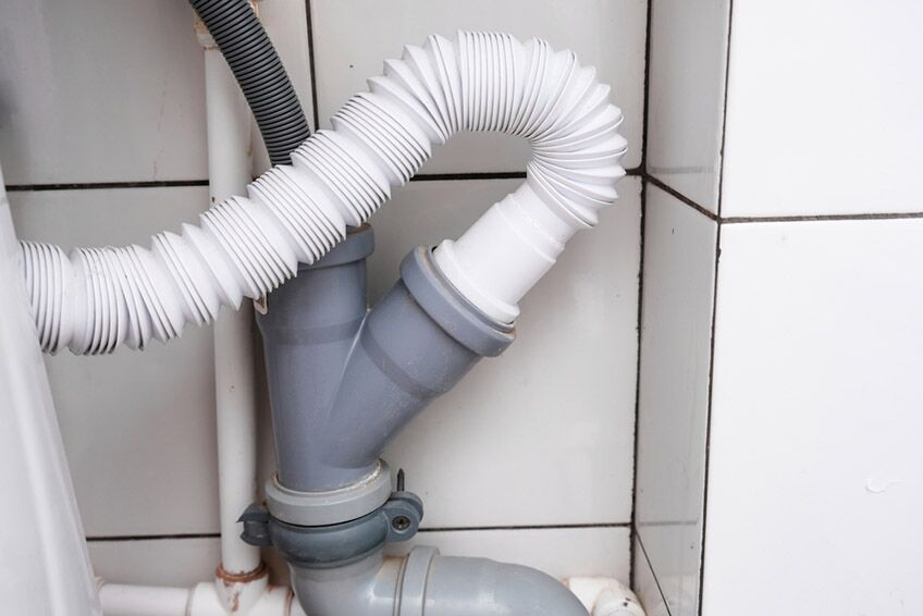Sewer,Pipes,In,Home,,Connection,Of,Grey,Polipropilen,Pipes,And Sewer pipes in home, connection of grey polipropilen pipes and white corrugated pan pipe for washbowl, wash basin drain